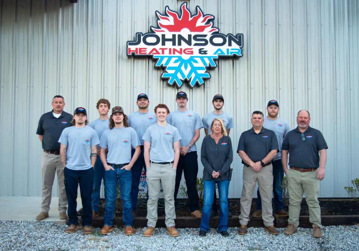 Johnson Heating & Air Conditioning team standing outside the company office